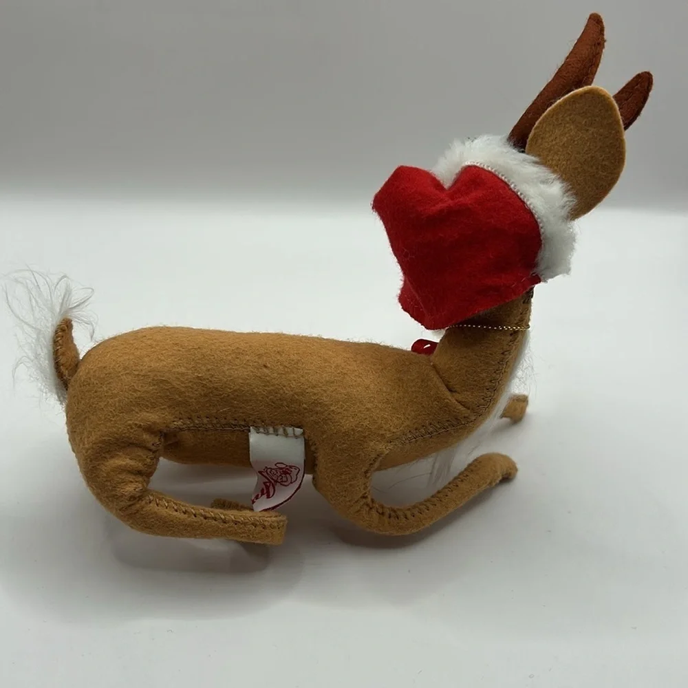 Annalee Reindeer wearing a Santa hat and bell
